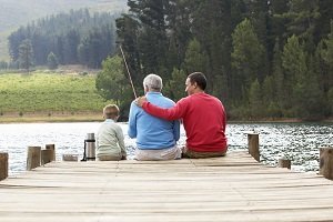 family fishing on dock